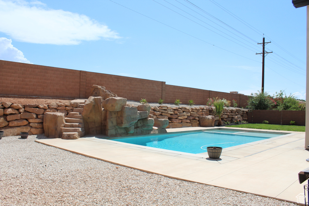 View of pool with a fenced backyard