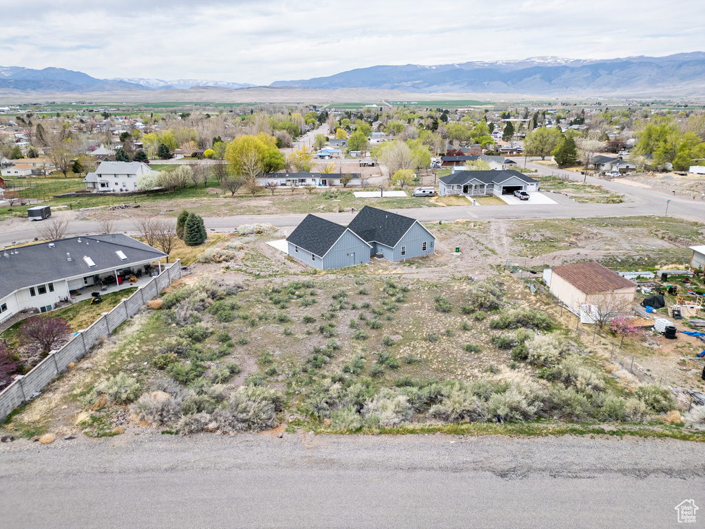Birds eye view of property with a residential view and a mountain view
