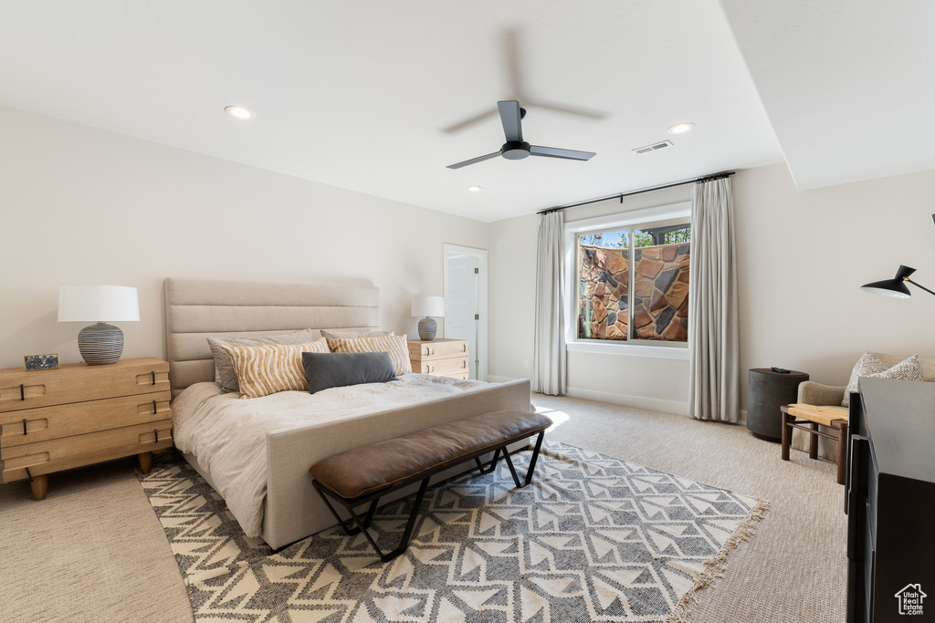 Bedroom featuring recessed lighting, visible vents, light carpet, baseboards, and ceiling fan