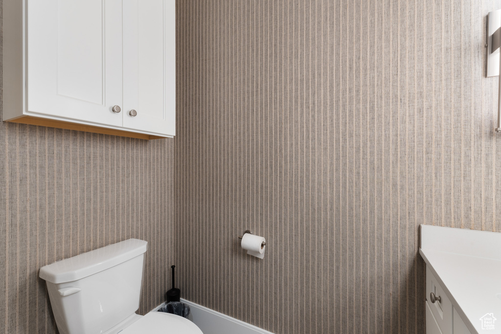 Bathroom with toilet and vanity