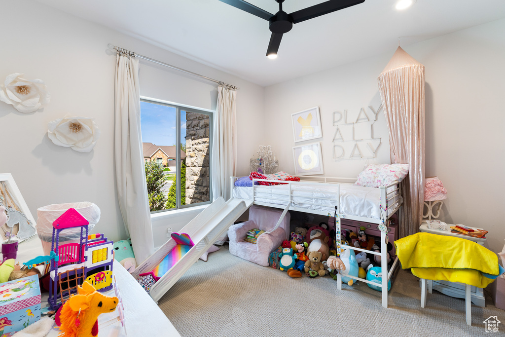 Bedroom with carpet flooring and a ceiling fan