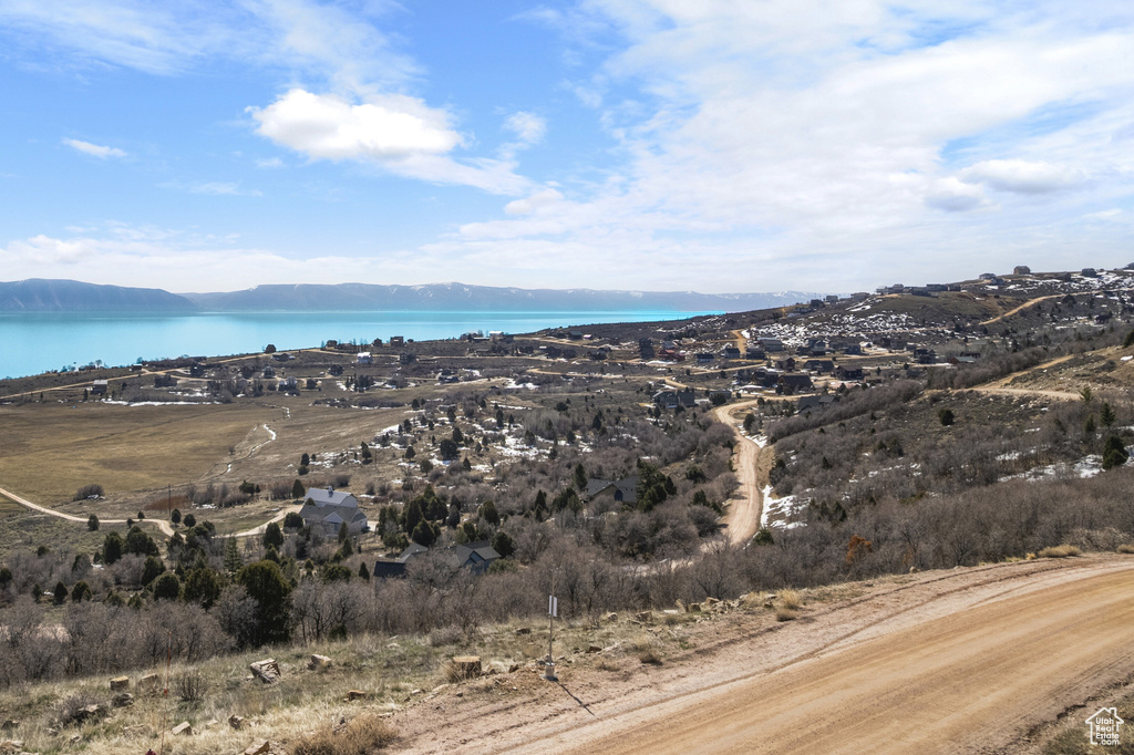 Property view of mountains featuring a water view
