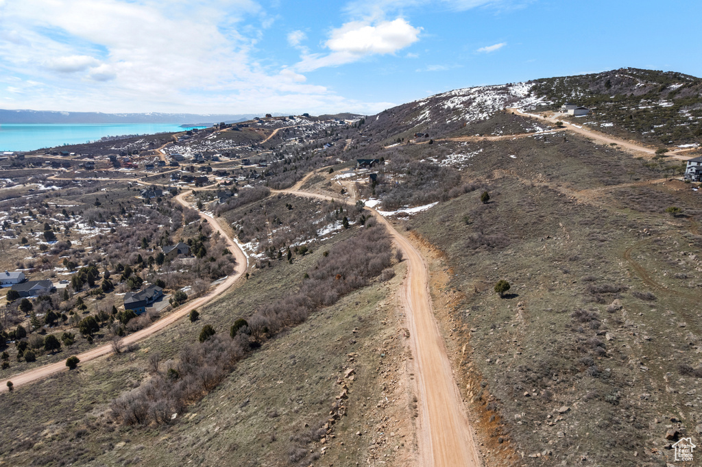 Drone / aerial view with a water and mountain view