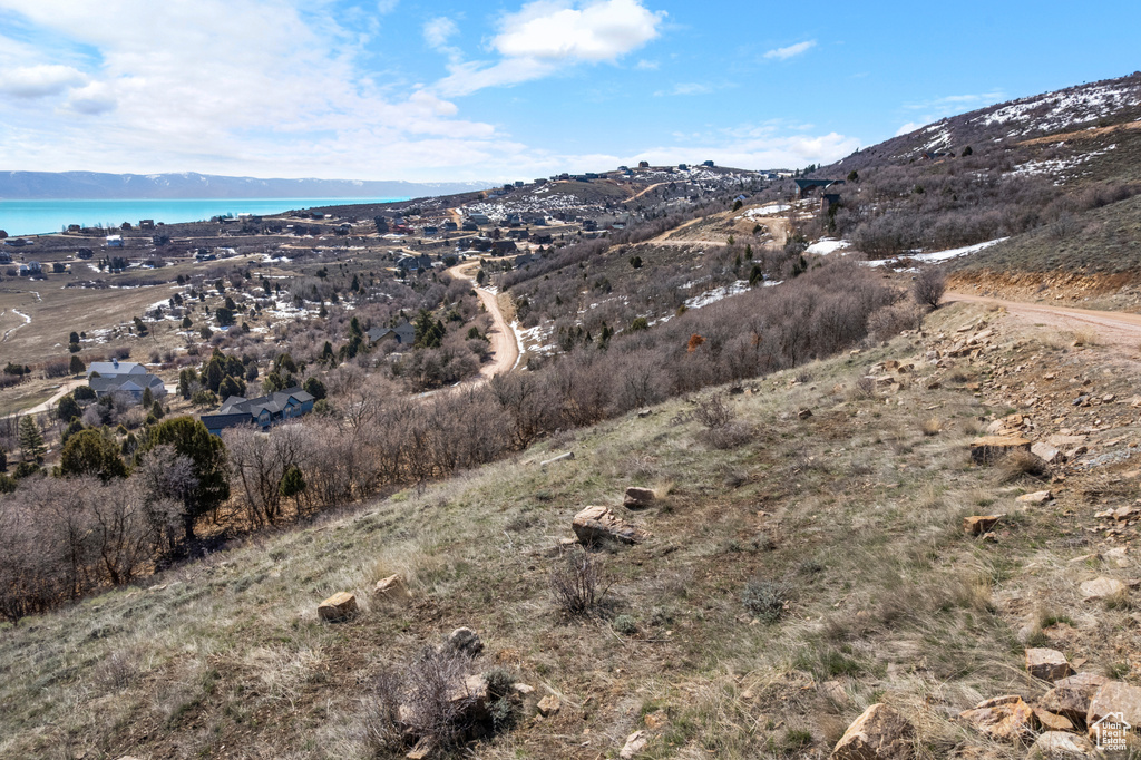 Property view of mountains featuring a water view