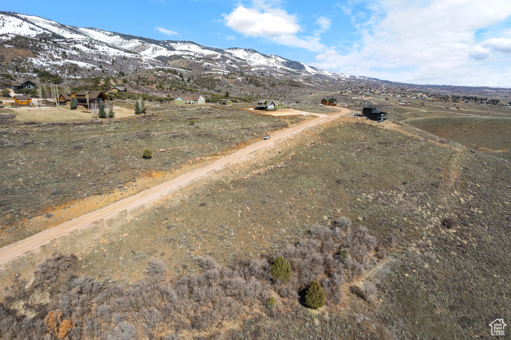 View of road with a rural view and a mountain view