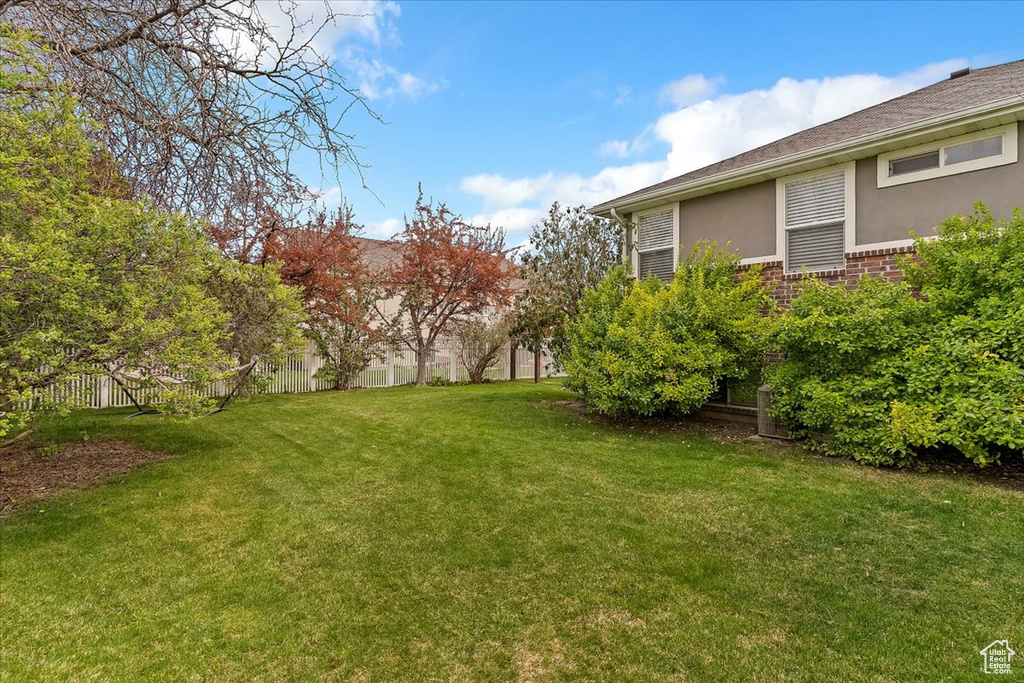 View of yard with fence