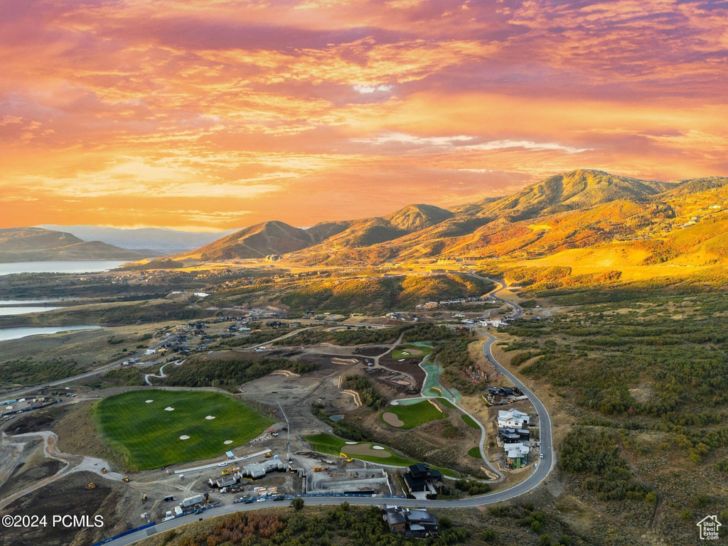 Aerial view at dusk with a water and mountain view