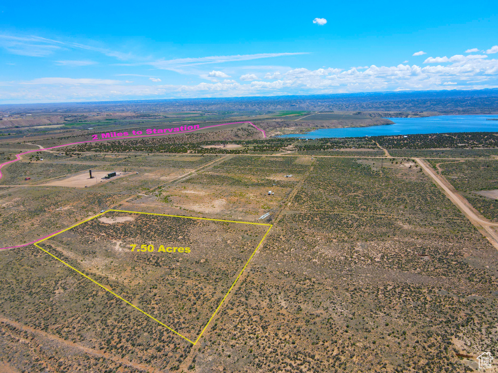 View of rural area with property boundaries highlighted and a nearby body of water