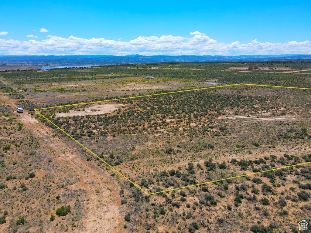 Overview of rural landscape featuring property parcel outlined and a mountain backdrop
