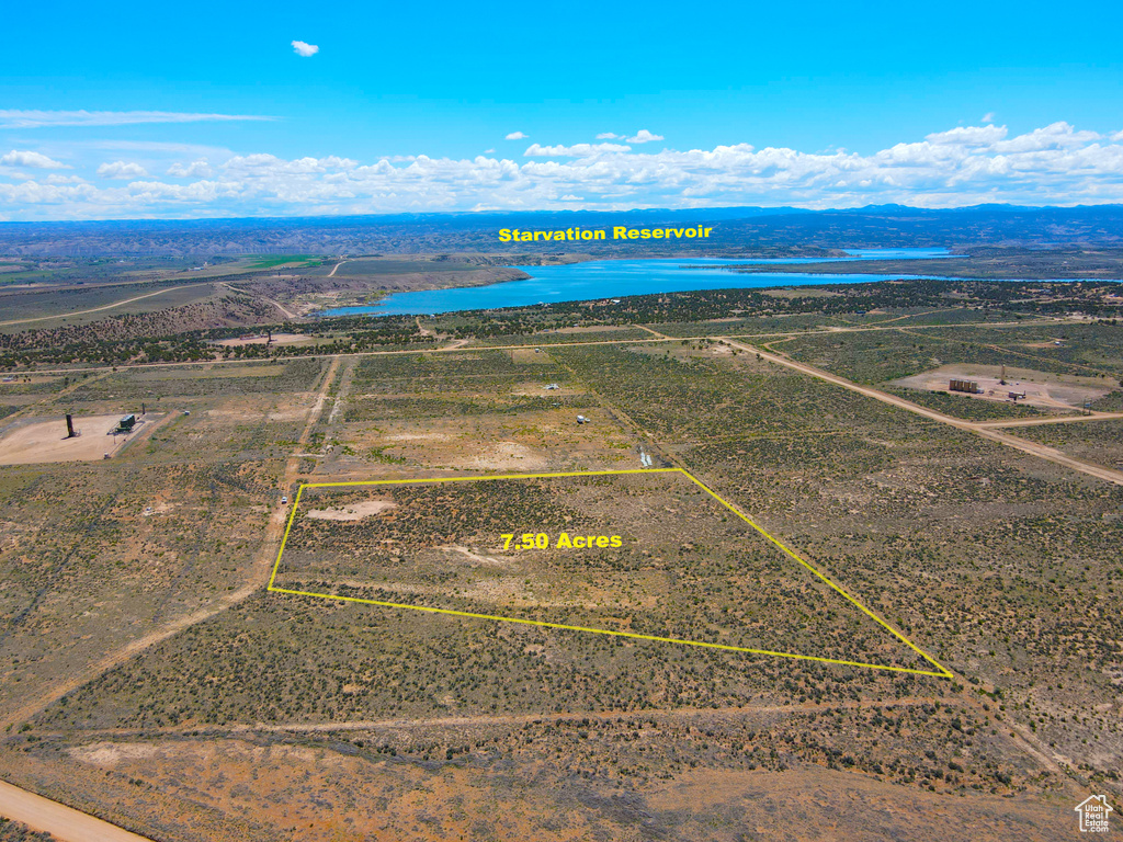 View of rural area featuring property boundaries highlighted and a water and mountain view