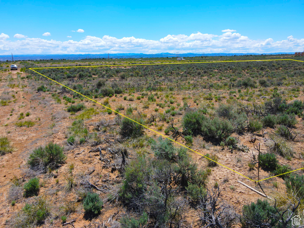 Aerial view of sparsely populated area with property parcel outlined