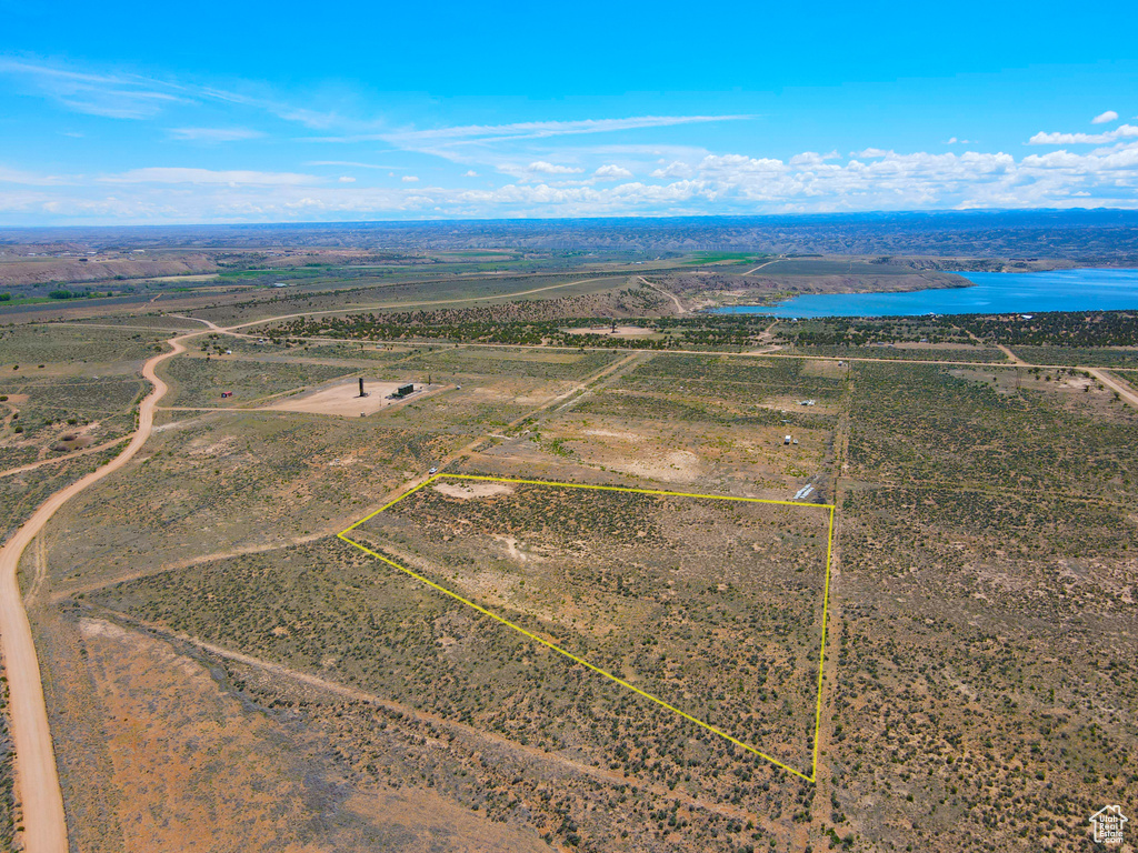 View of rural area with property parcel outlined and a nearby body of water
