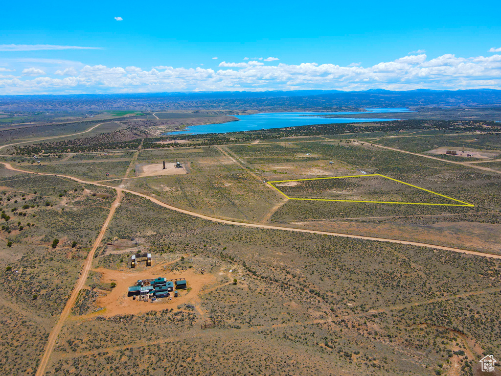 Aerial view of sparsely populated area featuring a water and mountain view