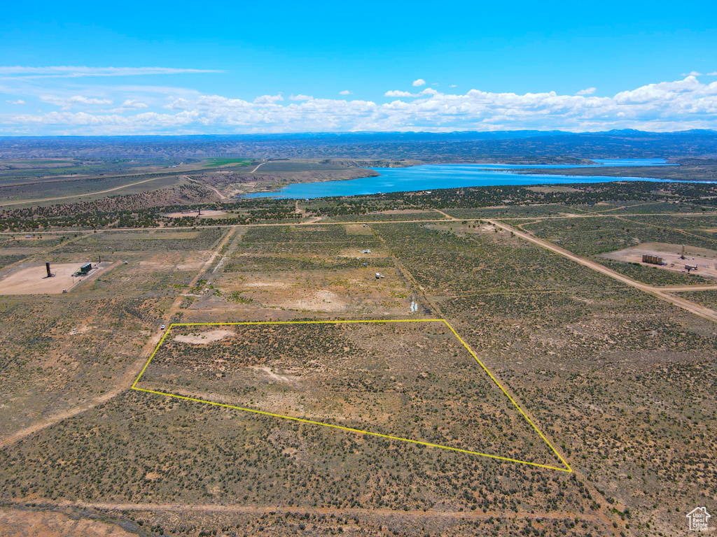 View of rural area with a nearby body of water and property boundaries highlighted