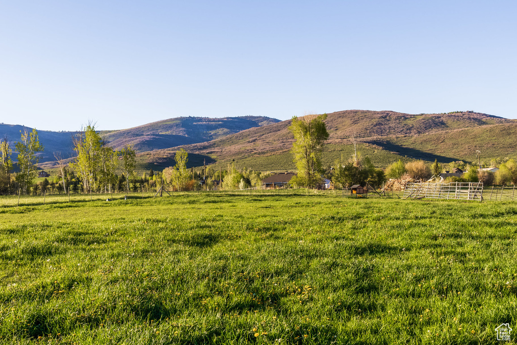 View of mountain background with rural landscape and agricultural land
