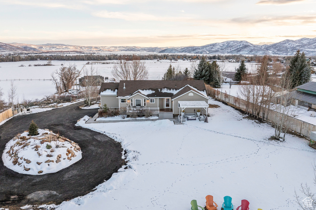 Snowy aerial view with a mountain view