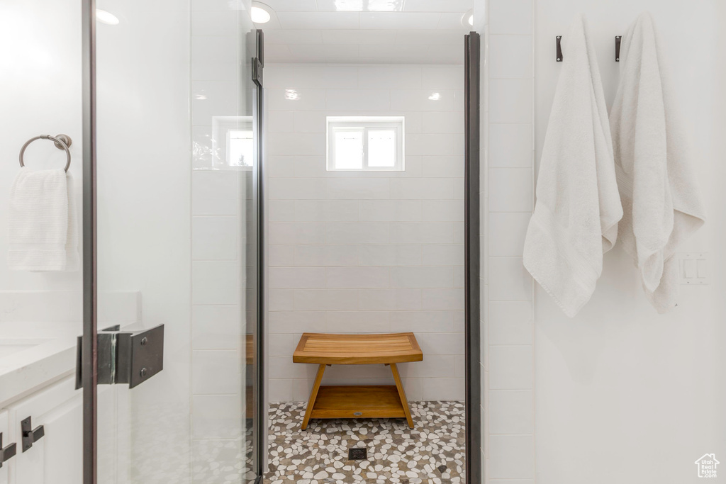 Full bathroom with a stall shower and vanity
