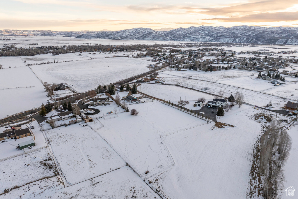 Snowy aerial view featuring a mountain view