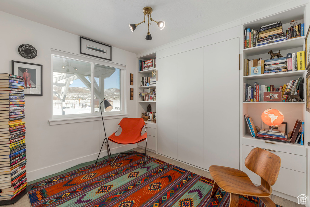 Sitting room featuring baseboards
