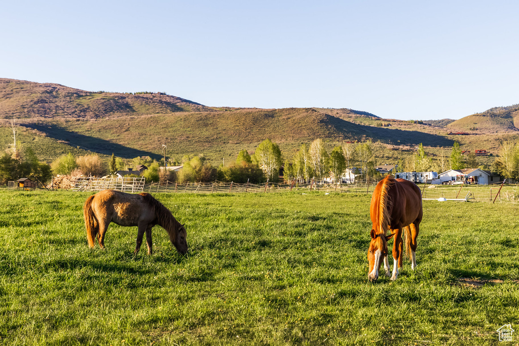 View of mountain background featuring rural landscape and agricultural land