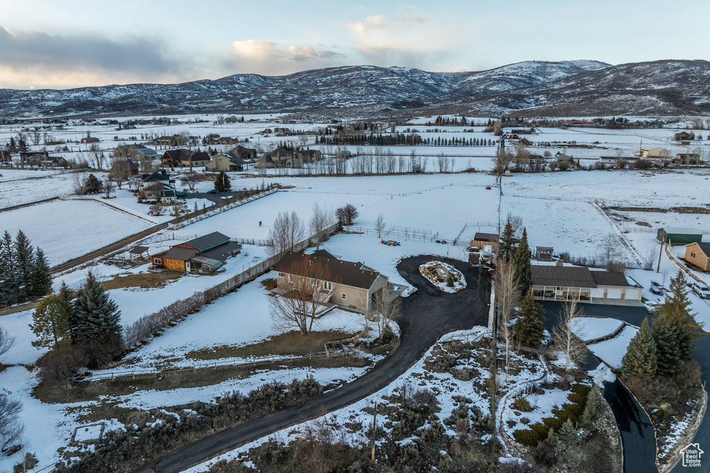 Snowy aerial view featuring a mountain view