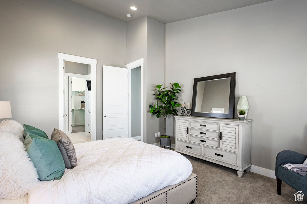 Carpeted bedroom featuring baseboards and recessed lighting