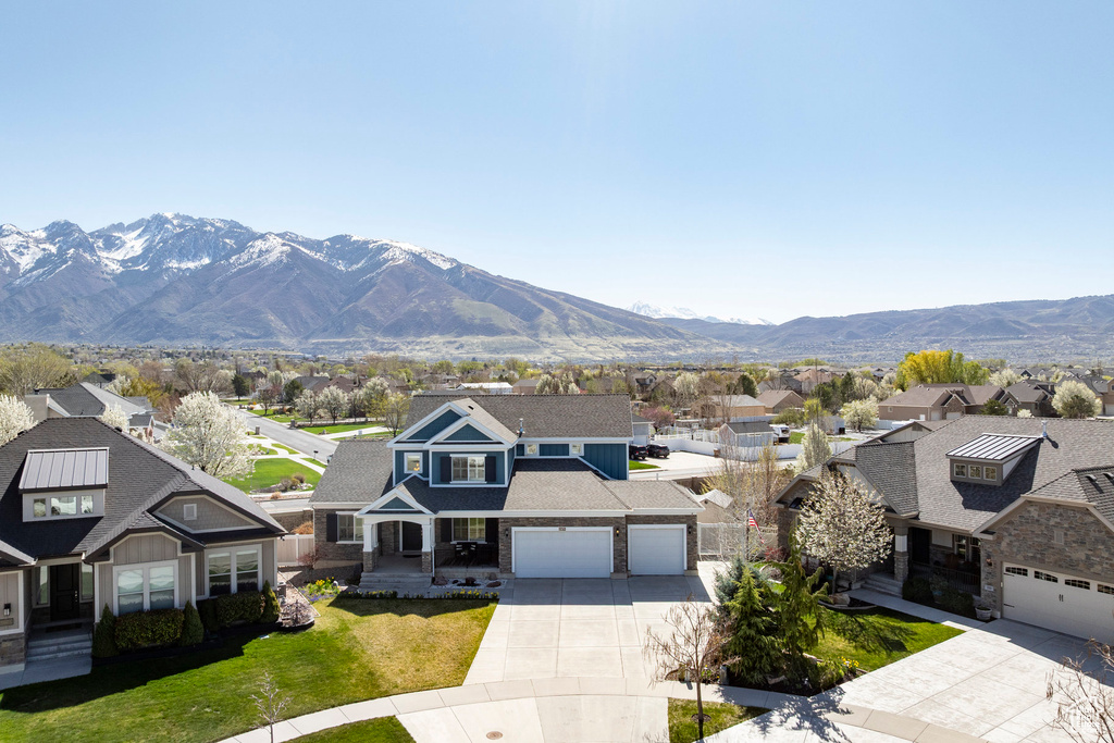 Property view of mountains with a residential view