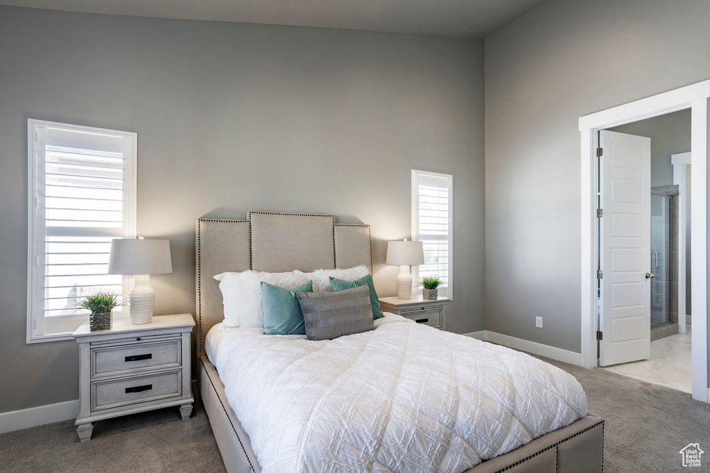 Carpeted bedroom featuring baseboards