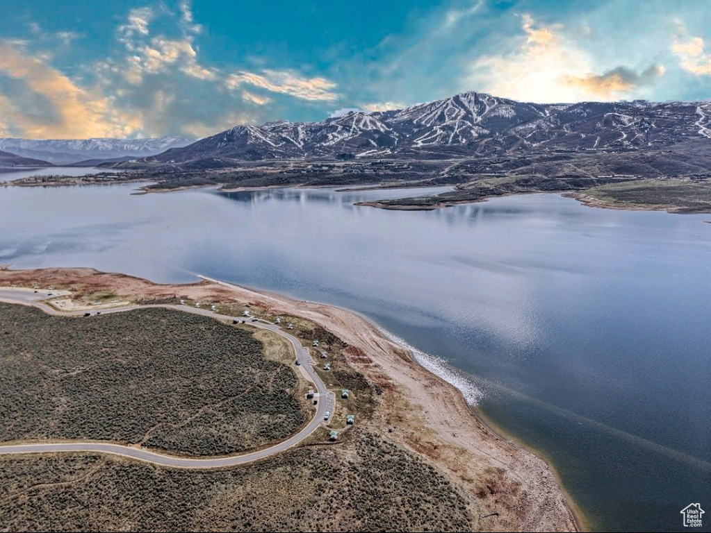 Aerial view featuring a water and mountain view