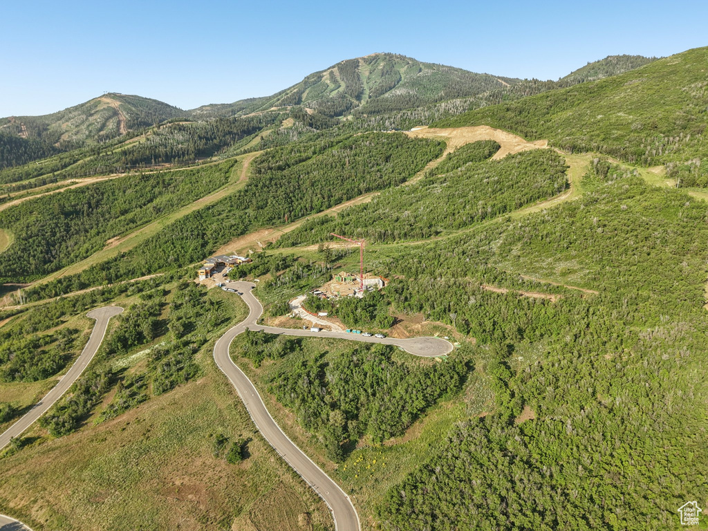 Aerial overview of property's location featuring a mountain backdrop