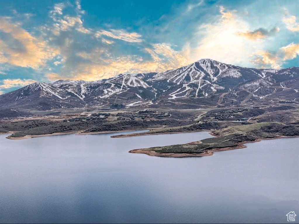 Property view of mountains featuring a water view