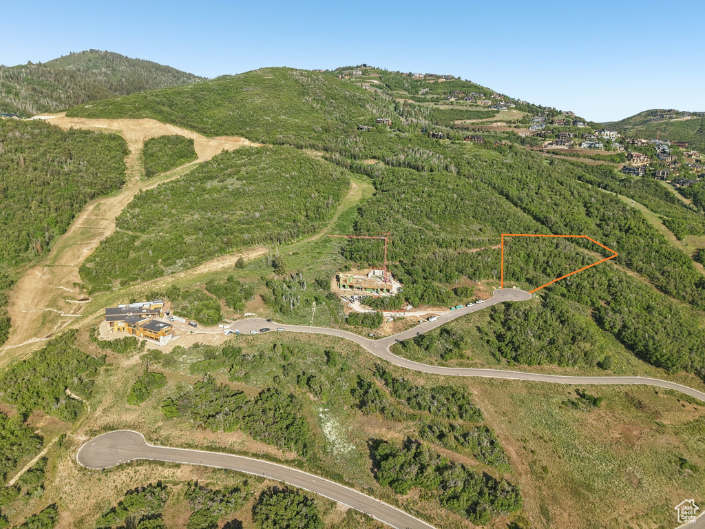 Aerial view of property's location featuring property parcel outlined and mountains