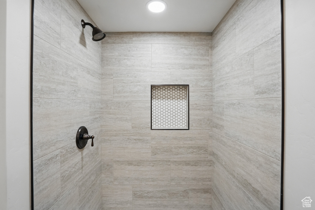 Full bathroom with a tile shower