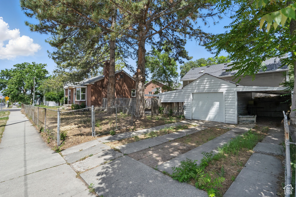 View of home's exterior featuring a garage and brick siding