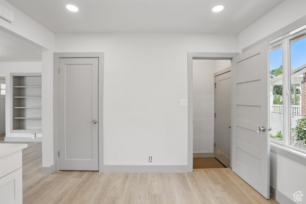 Unfurnished bedroom with light wood-style flooring and recessed lighting