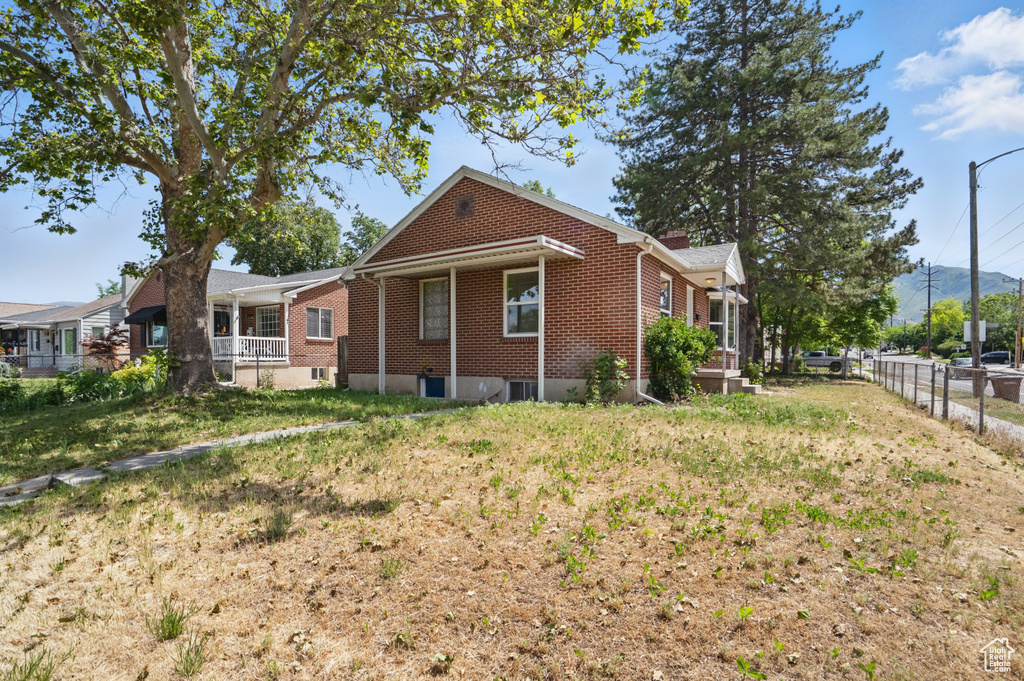 View of side of property with brick siding
