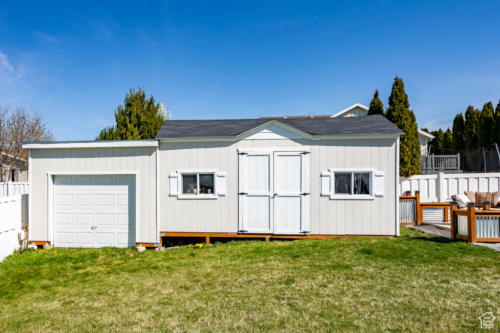 Garage featuring a storage shed