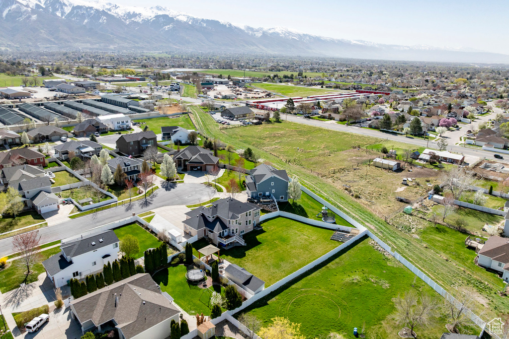 Aerial view of residential area featuring mountains