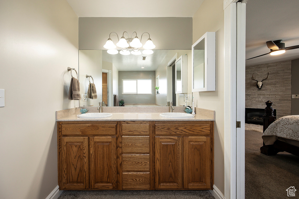 Ensuite bathroom with double vanity and baseboards