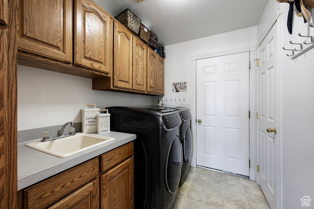 Laundry room with cabinet space and washing machine and dryer