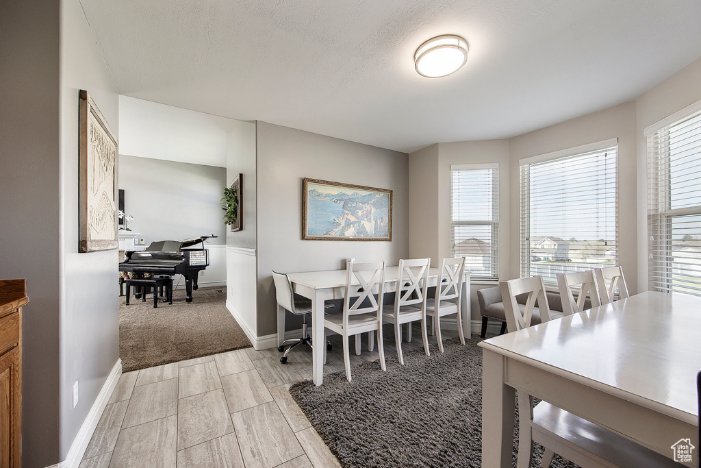 Dining room featuring wood finish floors and baseboards