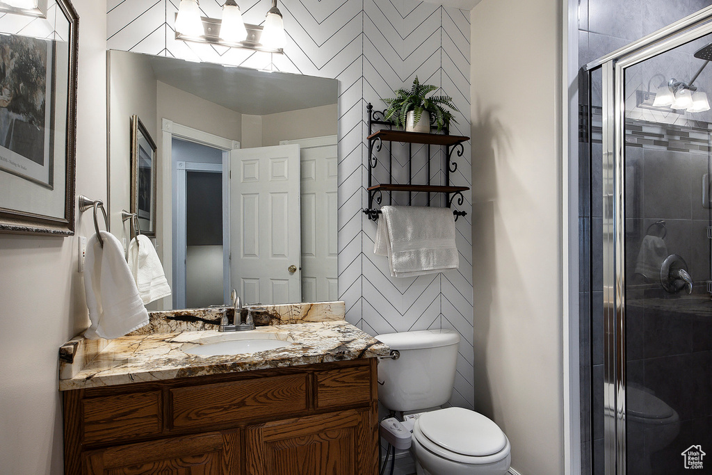 Full bathroom with a shower stall and vanity