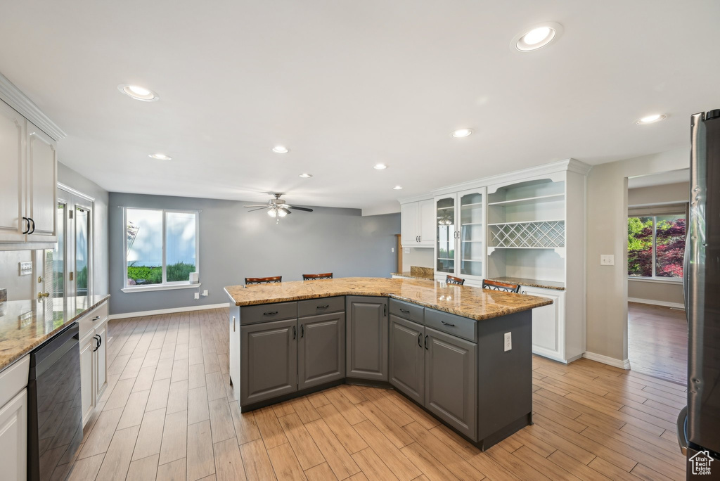 Kitchen with dishwasher, gray cabinets, a kitchen island, white cabinets, and freestanding refrigerator