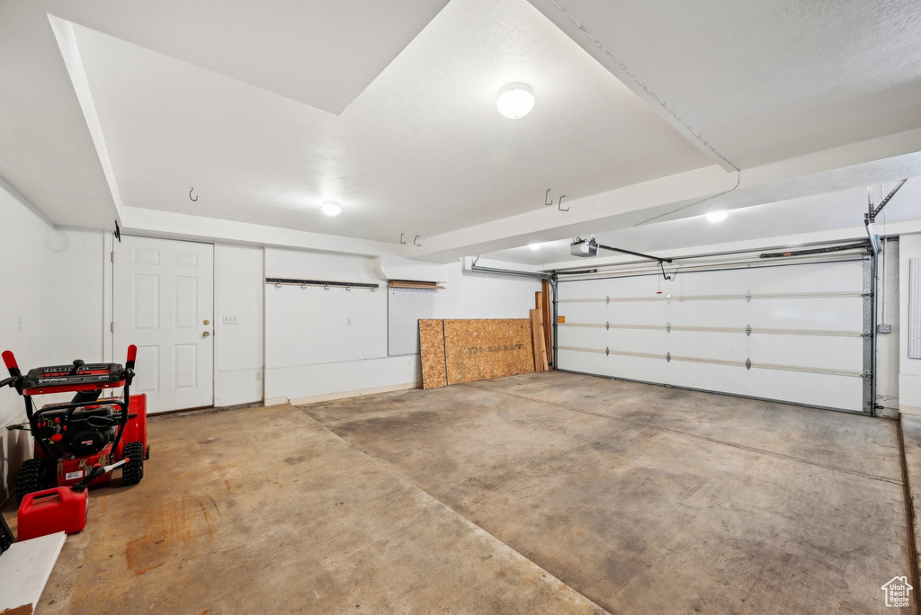 Garage featuring a garage door opener