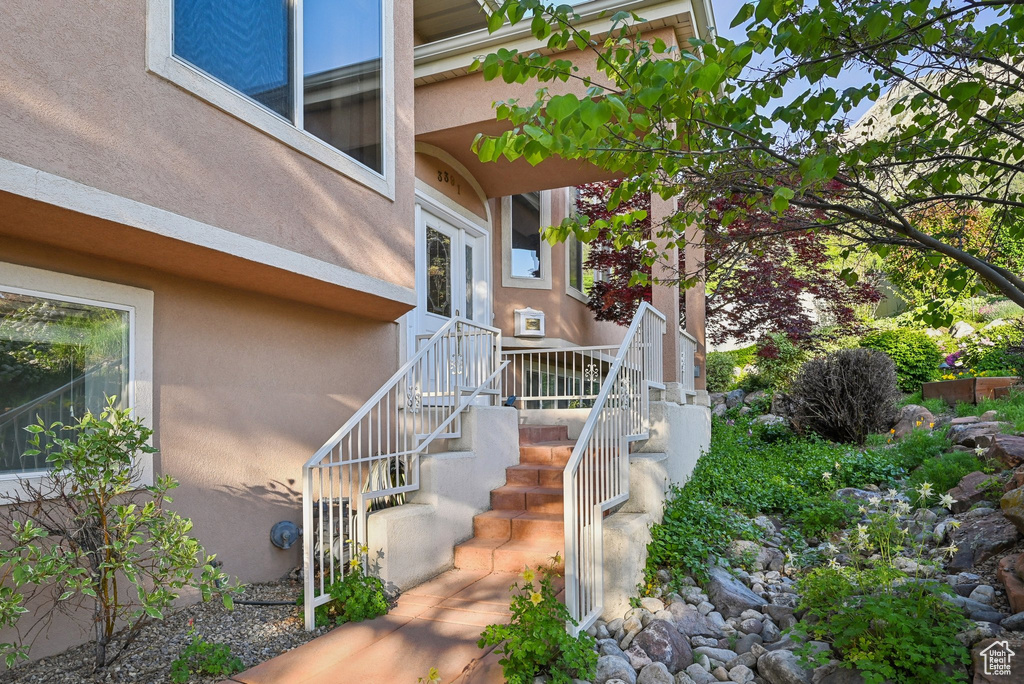 Property entrance with stucco siding