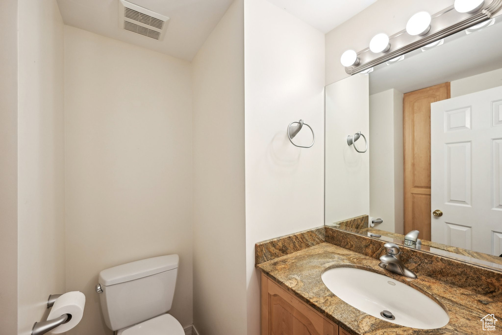 Half bath with toilet and vanity