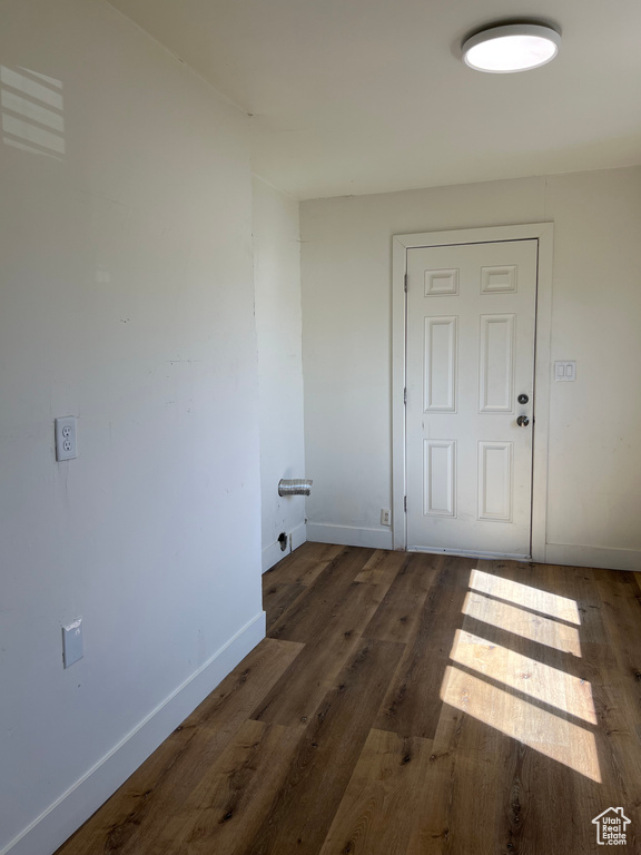 Interior space featuring baseboards and wood finished floors