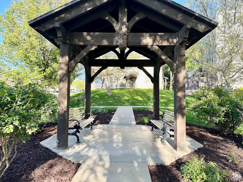 Surrounding community with a yard, a gazebo, and a patio area