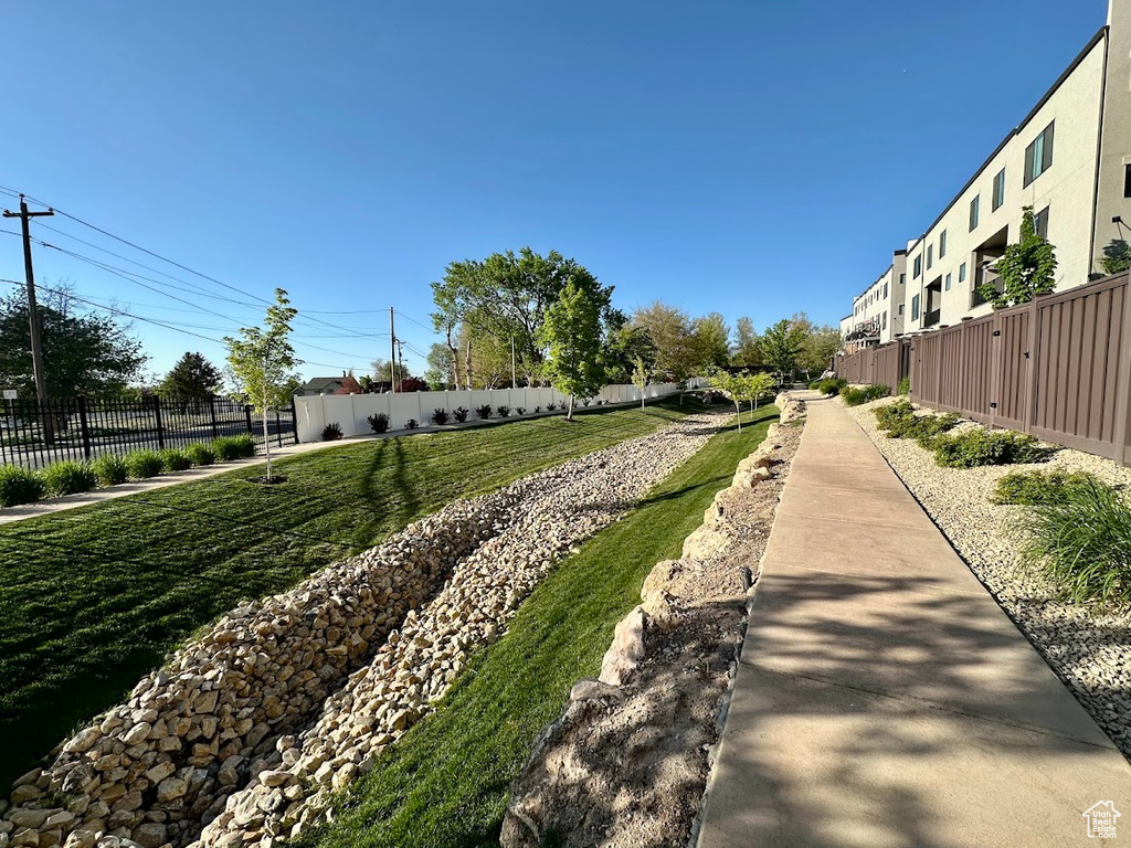 View of property's community featuring fence