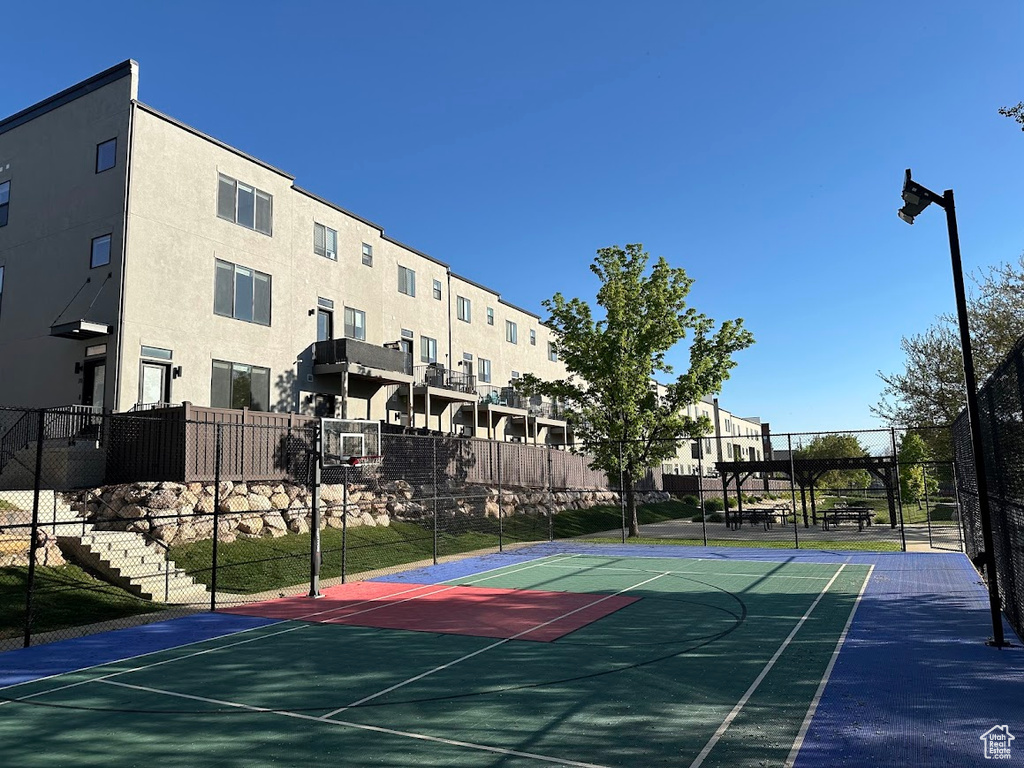 View of sport court featuring fence and community basketball court